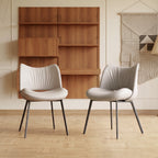 Upholstered chairs in gray colorway at modern dining setting