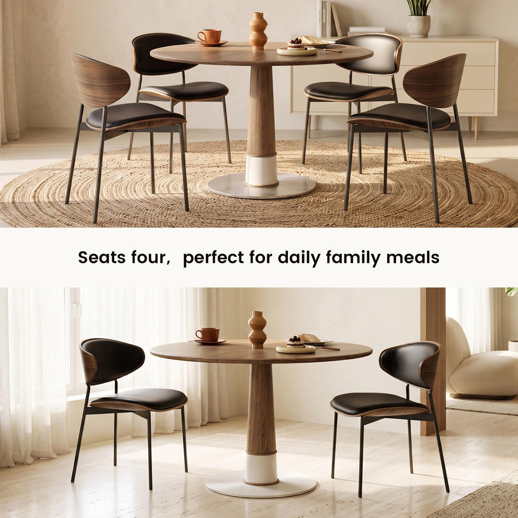 Walnut round dining table in styled apartment dining room