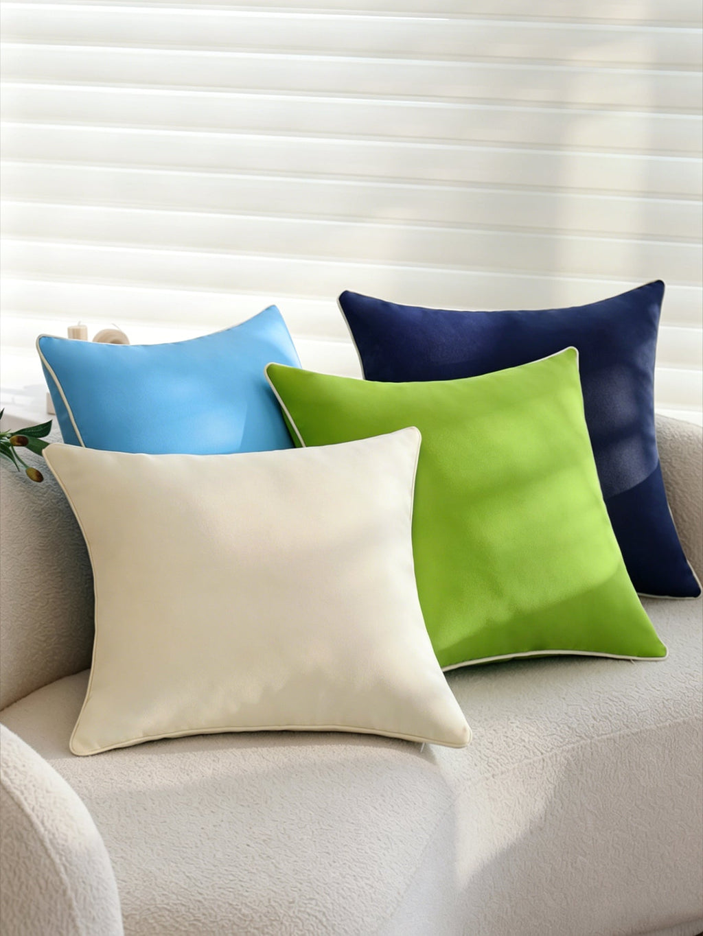 Cream weatherproof throw pillow lifestyle shot