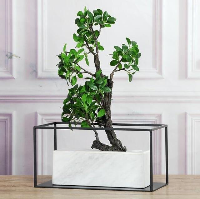 Marble vase with gold frame on dining table